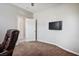 Office space showcasing a mounted TV and comfortable seating at 9496 Wild Valley Ave, Las Vegas, NV 89148