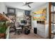 Inviting office space featuring a ceiling fan, a variety of artwork, and custom shelving at 9496 Wild Valley Ave, Las Vegas, NV 89148
