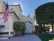 Charming single Gathering home featuring a well-manicured lawn, attractive landscaping, and an American flag at , Las Vegas, NV 89117