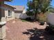 Low maintenance backyard with rock cover and trees at 10195 Queensbury Ave, Las Vegas, NV 89135
