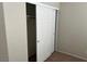 Open bedroom closet showing storage space at 10195 Queensbury Ave, Las Vegas, NV 89135