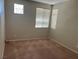 Neutral bedroom with carpet, and bright windows at 10195 Queensbury Ave, Las Vegas, NV 89135
