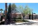 Lovely single-story house features desert landscaping, mature trees, and a two-car garage at 10195 Queensbury Ave, Las Vegas, NV 89135