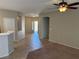 Open living space with tile floors, access to the backyard, and a view of the kitchen area at 10195 Queensbury Ave, Las Vegas, NV 89135
