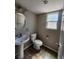 Charming bathroom with a pedestal sink and modern fixtures at 10400 Beachwalk Pl, Las Vegas, NV 89144