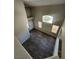 Open living room with laminate floors, and large windows for natural light at 10400 Beachwalk Pl, Las Vegas, NV 89144