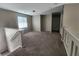 Open living room area with plush carpeting at 10400 Beachwalk Pl, Las Vegas, NV 89144