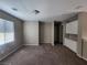 Open living room area with plush carpeting and lots of light at 10400 Beachwalk Pl, Las Vegas, NV 89144