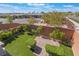 Landscaped backyard with artificial turf, brick walls and paved patio at 10793 Pastel Sunset Ct, Las Vegas, NV 89135
