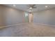 Large carpeted bedroom with neutral paint and a bright window view at 10793 Pastel Sunset Ct, Las Vegas, NV 89135