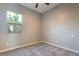 Neutral bedroom with carpet flooring and a sunlit window at 10793 Pastel Sunset Ct, Las Vegas, NV 89135
