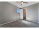 Spacious bedroom with plush carpet, and a window with natural light at 10793 Pastel Sunset Ct, Las Vegas, NV 89135