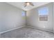 Carpeted bedroom with light-grey walls and multiple windows at 10793 Pastel Sunset Ct, Las Vegas, NV 89135