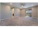 Bright carpeted bedroom with sliding door access to the outdoor balcony at 10793 Pastel Sunset Ct, Las Vegas, NV 89135