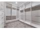 Spacious walk-in closet with custom shelving and drawers, offering ample storage at 10793 Pastel Sunset Ct, Las Vegas, NV 89135