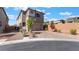 This modern two-story home offers desert landscaping, attractive brick accents, and a brick paver driveway at 10793 Pastel Sunset Ct, Las Vegas, NV 89135