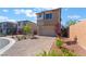 A stylish two-story home with landscaping, stone facade, and a brick driveway for curb appeal at 10793 Pastel Sunset Ct, Las Vegas, NV 89135