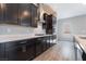 Gourmet kitchen with stainless steel appliances, gas cooktop, and a modern vent hood at 10793 Pastel Sunset Ct, Las Vegas, NV 89135