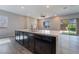 The kitchen features a large island, stainless steel appliances, dark cabinets, and recessed lighting at 10793 Pastel Sunset Ct, Las Vegas, NV 89135
