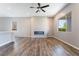 Bright living area with a decorative fireplace and seamless access to the dining area and kitchen at 10793 Pastel Sunset Ct, Las Vegas, NV 89135