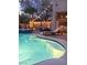 Backyard with a pool, spa, lush landscaping, and outdoor seating at 11219 Playa Bonita Ave, Las Vegas, NV 89138