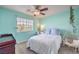 Bedroom featuring teal walls, hanging chair, and natural light at 11219 Playa Bonita Ave, Las Vegas, NV 89138