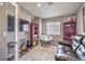 Cozy room featuring a papasan chair, a keyboard, and a comfortable leather couch at 11219 Playa Bonita Ave, Las Vegas, NV 89138