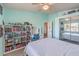 Comfortable bedroom with carpet, built-in shelving, desk, and closet space at 11219 Playa Bonita Ave, Las Vegas, NV 89138