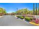 Gated community entrance with lush landscaping and a welcoming 'San Marcos' sign at 11219 Playa Bonita Ave, Las Vegas, NV 89138