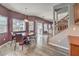 Bright dining room with wood floors and views of the backyard and patio at 11219 Playa Bonita Ave, Las Vegas, NV 89138