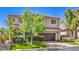 Charming two-story home with well-manicured lawn and attached two-car garage at 11219 Playa Bonita Ave, Las Vegas, NV 89138