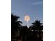 Festive fireworks display over a community with palm trees create a vibrant, celebratory atmosphere at 11219 Playa Bonita Ave, Las Vegas, NV 89138