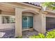 Inviting front entrance with double doors, stone accents, and a welcoming wreath at 11219 Playa Bonita Ave, Las Vegas, NV 89138