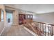 Upstairs hallway featuring a view of the living room and staircase below at 11219 Playa Bonita Ave, Las Vegas, NV 89138