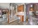 Hallway with stairs features a built-in desk and storage cabinets at 11219 Playa Bonita Ave, Las Vegas, NV 89138
