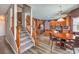 Open kitchen and staircase. Ample lighting, granite countertops, stainless steel appliances and breakfast table at 11219 Playa Bonita Ave, Las Vegas, NV 89138