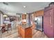 Open kitchen and living space features a kitchen island and stainless appliances at 11219 Playa Bonita Ave, Las Vegas, NV 89138
