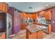 Charming kitchen with wood cabinets, granite countertops, and stainless steel appliances at 11219 Playa Bonita Ave, Las Vegas, NV 89138