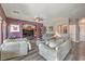 Comfortable living room features plush sofas, wood floors and built in shelving at 11219 Playa Bonita Ave, Las Vegas, NV 89138