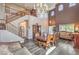 Elegant living room with high ceilings, staircase and dining area at 11219 Playa Bonita Ave, Las Vegas, NV 89138