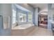 Bright main bathroom with a large soaking tub under bay windows and views into the spacious main bedroom at 11219 Playa Bonita Ave, Las Vegas, NV 89138
