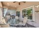 Outdoor patio with a stone floor, grill, table, and seating at 11219 Playa Bonita Ave, Las Vegas, NV 89138