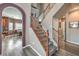Carpeted staircase with wooden railing leads to the upper level of the home at 11219 Playa Bonita Ave, Las Vegas, NV 89138