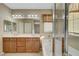 Bathroom boasts a double vanity, soaking tub, and enclosed glass shower at 11420 Ogden Mills Dr # 101, Las Vegas, NV 89135