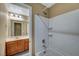 Bathroom featuring shower over tub and a vanity with warm color scheme at 11420 Ogden Mills Dr # 101, Las Vegas, NV 89135