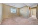 Large bedroom with neutral walls and carpet, offering a comfortable and adaptable space at 11420 Ogden Mills Dr # 101, Las Vegas, NV 89135