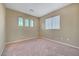 Bedroom with ample natural light from multiple windows and neutral colored walls at 11420 Ogden Mills Dr # 101, Las Vegas, NV 89135