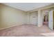 Expansive bedroom features neutral walls, neutral carpeting, and an open doorway at 11420 Ogden Mills Dr # 101, Las Vegas, NV 89135