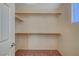 Walk-in closet with installed shelving and neutral carpeting at 11420 Ogden Mills Dr # 101, Las Vegas, NV 89135