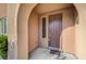 Covered entryway with a solid front door and adjacent window, providing natural light at 11420 Ogden Mills Dr # 101, Las Vegas, NV 89135